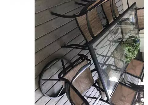 All weather Deluxe outdoors glass dining table and six chairs for sale